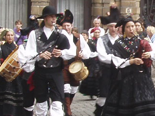 Belgian bagpipers marching though the Grand Place