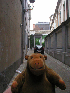 Mr Monkey looking at a trompe d'oiel forest down a side street