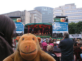 Mr Monkey watching a jazz band on a fairly distant stage