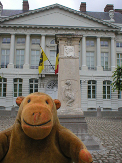 Mr Monkey looking at a monument in the Place des Martyrs