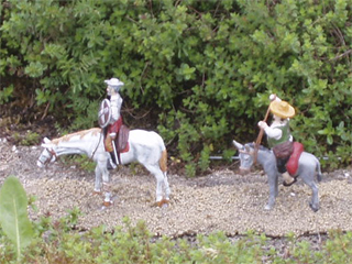 Don Quixote and Sancho Panza on their way to a windmill