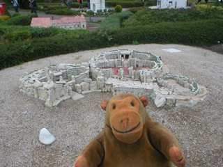 Mr Monkey looking at the temple of Mnajdra on Malta