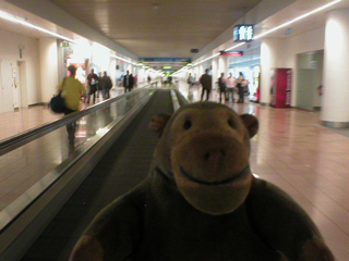 Mr Monkey on a moving walkway at Brussels airport