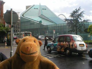 Mr Monkey looking at Urbis from Victoria Station