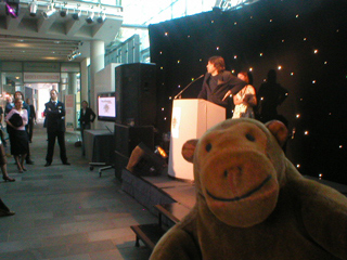 Mr Monkey watching Peter Saville talk about the Best of Manchester awards process