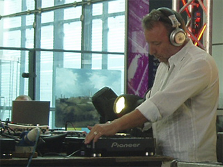 Peter Hook concentrating on DJing