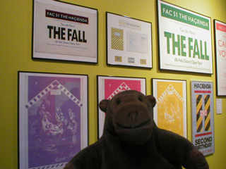 Mr Monkey looking at Hacienda posters