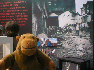 Mr Monkey looking at pictures of the Ha&ccedila;ienda being demolished