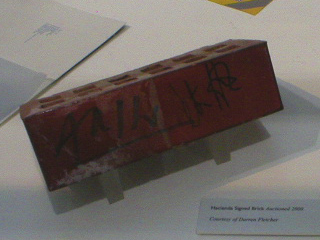 An autographed brick from the Hacienda