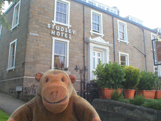 Mr Monkey outside the Studley Hotel
