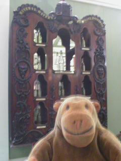 Mr Monkey looking at a collection of Harrogate waters from 1851