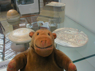 Mr Monkey looking at laminated paper work by Hannah Lobley