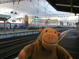 Mr Monkey watching a train leaving Piccadilly Station