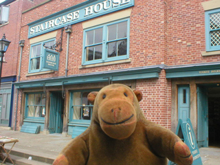 Mr Monkey looking at the front of Staircase House