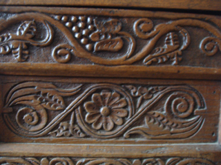Carving on one of the linen presses