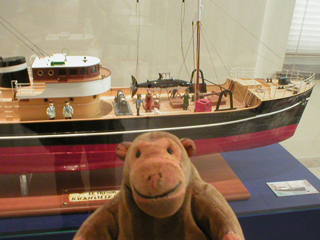 Mr Monkey looking at a large scale model of the Sirius