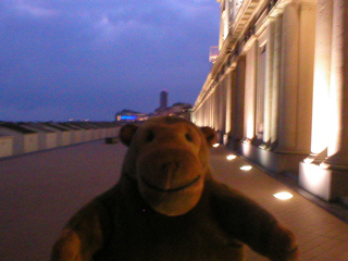 Mr Monkey looking along the promenade at dusk