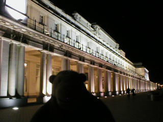 Mr Monkey outside the Thermae Palace in the dark