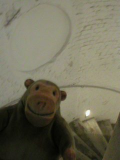 Mr Monkey going down a spiral staircase