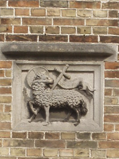 The Paschal Lamb above the alley