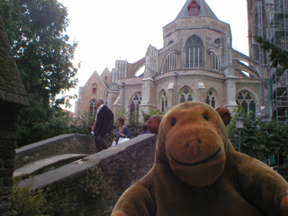 Mr Monkey looking at Onze Lieve Vrouwekerk from across the bridge
