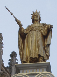 A gilded statue atop the gateway at the end of Blind Donkey Alley