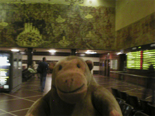 Mr Monkey in the main hall of Bruges station