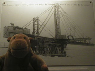 Mr Monkey looking at a photo of the Titan crane