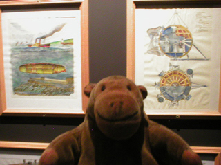 Mr Monkey looking at old submarine designs