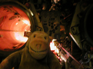 Mr Monkey looking at torpedo tubes in the aft torpedo room