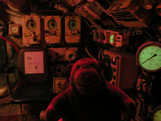 Mr Monkey looking at the helmsman's chair