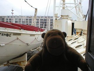 Mr Monkey looking at the lifeboat of the lightship