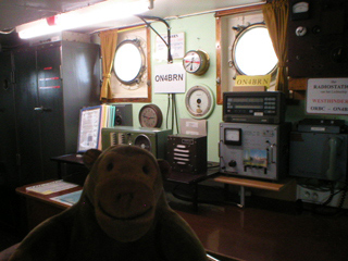 Mr Monkey looking into the radio room of the West-Hinder II