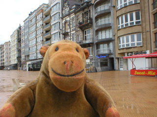 Mr Monkey on the rainy promenade at Ostende