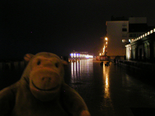 Mr Monkey on the rainy promenade at Ostende in the dark