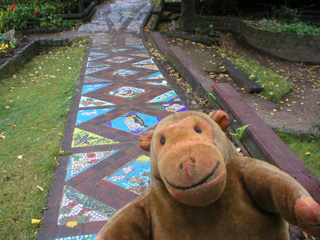 Mr Monkey examining a mosaic path