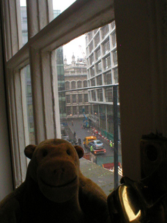 Mr Monkey looking out of the side window of the garret