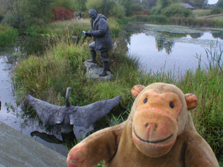 Mr Monkey looking at Peter Scott and the swans outside the London Wetlands Centre
