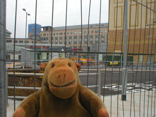 Mr Monkey looking at Hammersmith bus station
