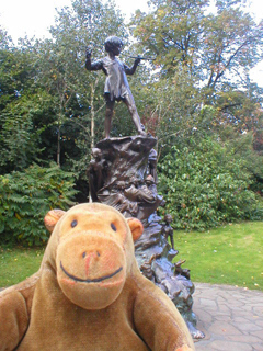 Mr Monkey looking at the statue of Peter Pan