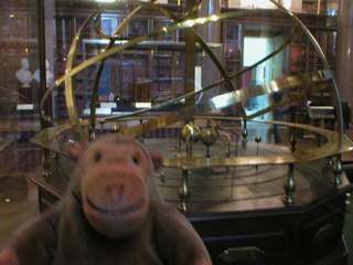 Mr Monkey examining an orrery in the  British Museum