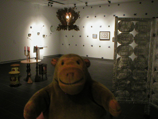 Mr Monkey looking across half of the exhibition