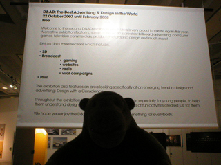 Mr Monkey reading the introductory poster for the A&AD exhibition