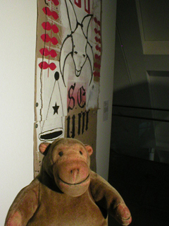 Mr Monkey looking at an untitled painting by Peter Rayner
