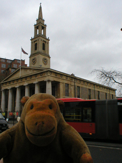 Mr Monkey looking at the church of St. John the Evangelist