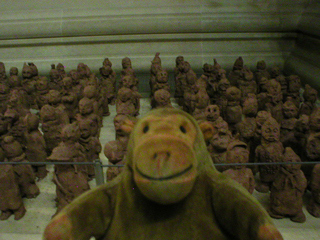 Mr Monkey examining children's models of the Terracotta Army