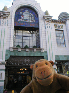 Mr Monkey looking at the front of the  Bibendum building