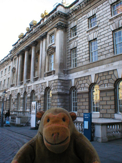 Mr Monkey looking at the inside face of the Embankment wing of Somerset House