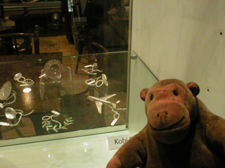 Mr Monkey looking at jewelery by Kobi Roth