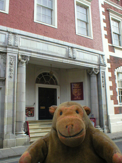 Mr Monkey outside the cinema entrance beside Fairfax House